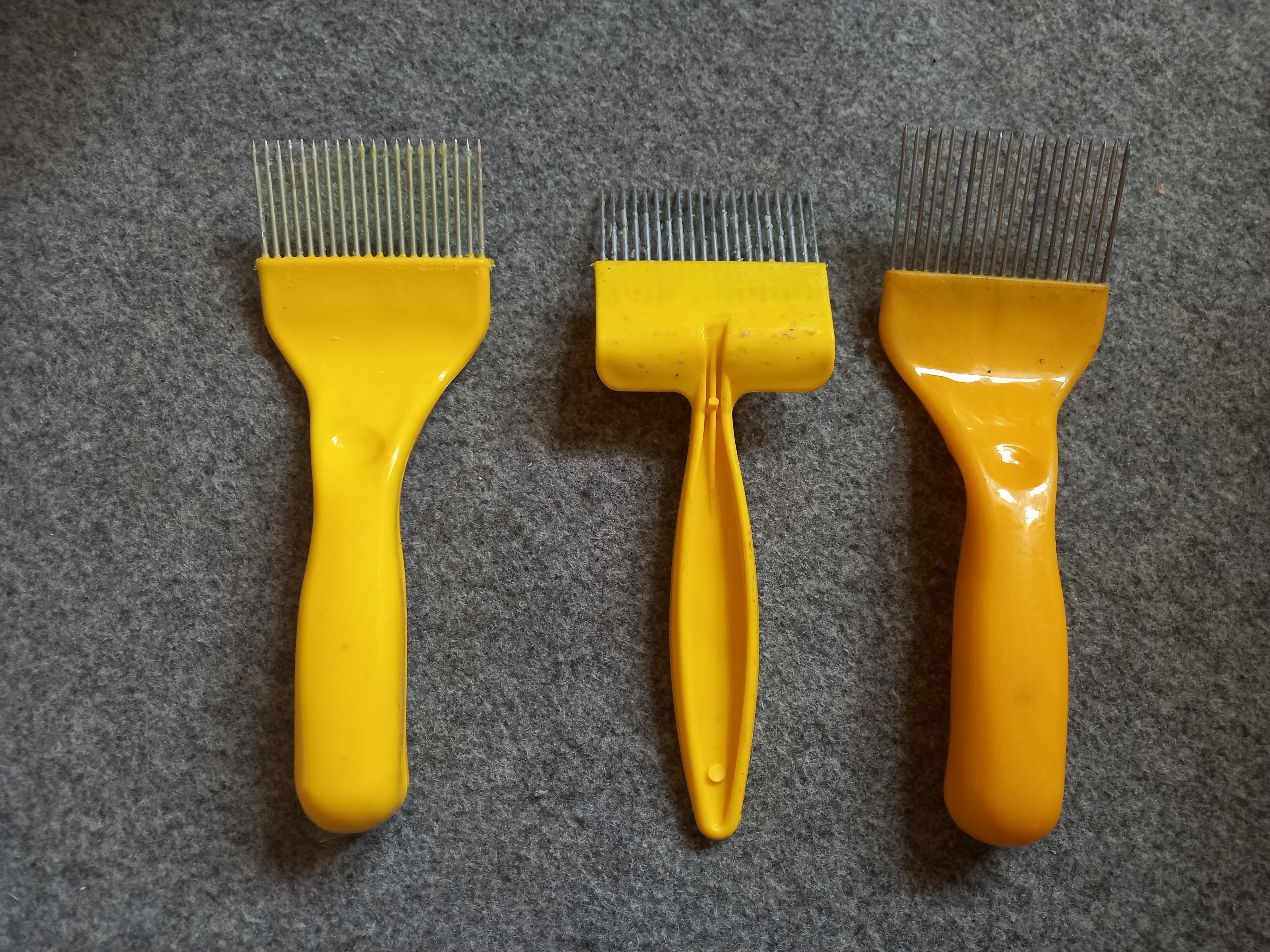 Honeycomb uncapping brush in Ghana image